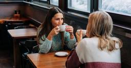 Two early childhood educators at a coffee shop during their break