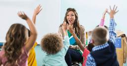 Preschool teacher leading circle time